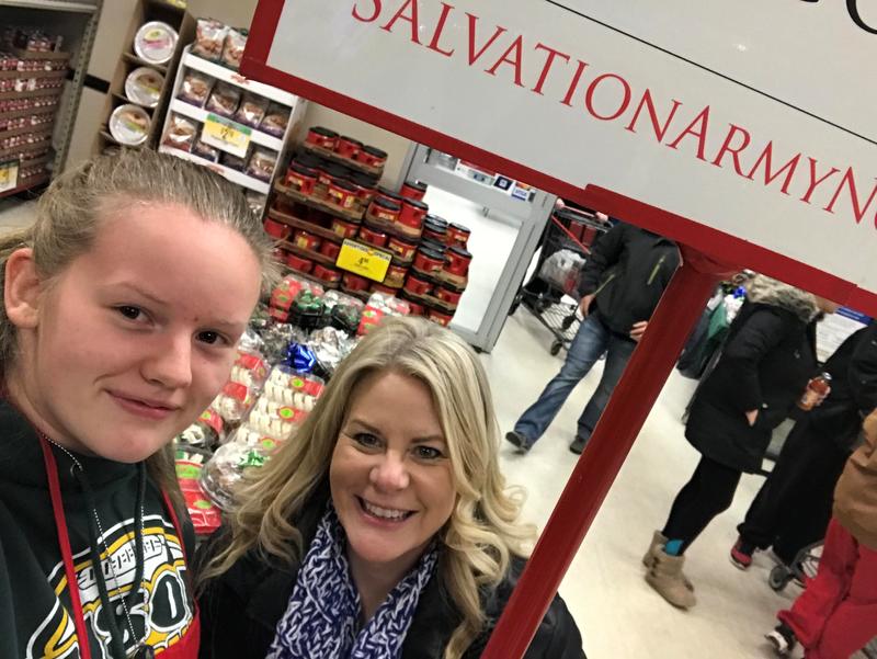 Mrs. Soulis and Madison W. help with Salvation Army collections